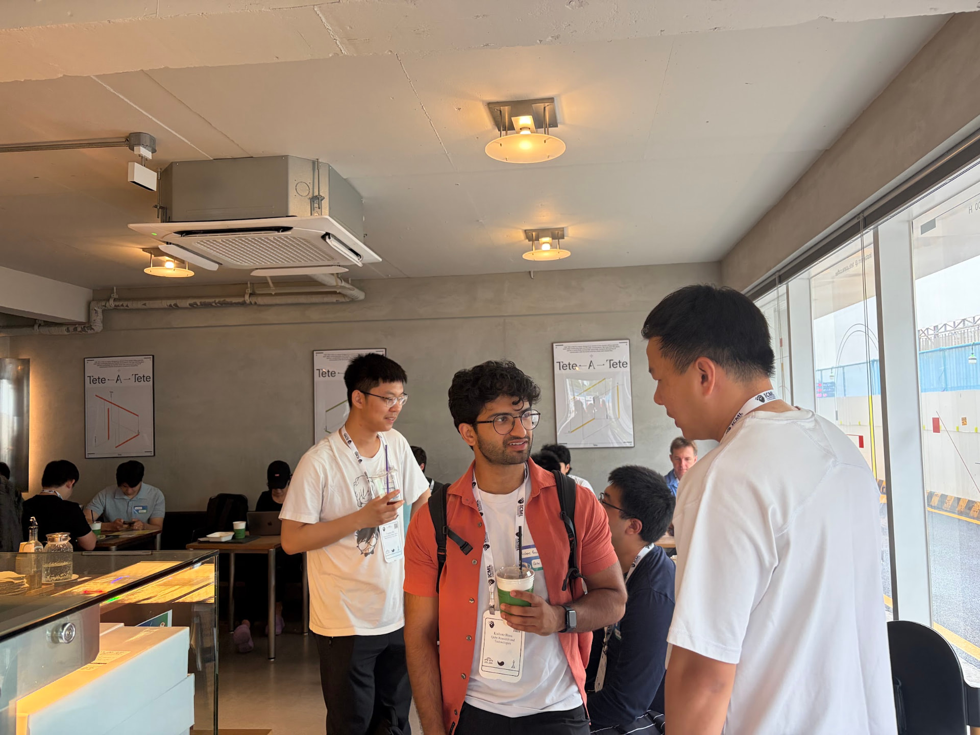 Researchers talking over drinks at Cafe GMI
