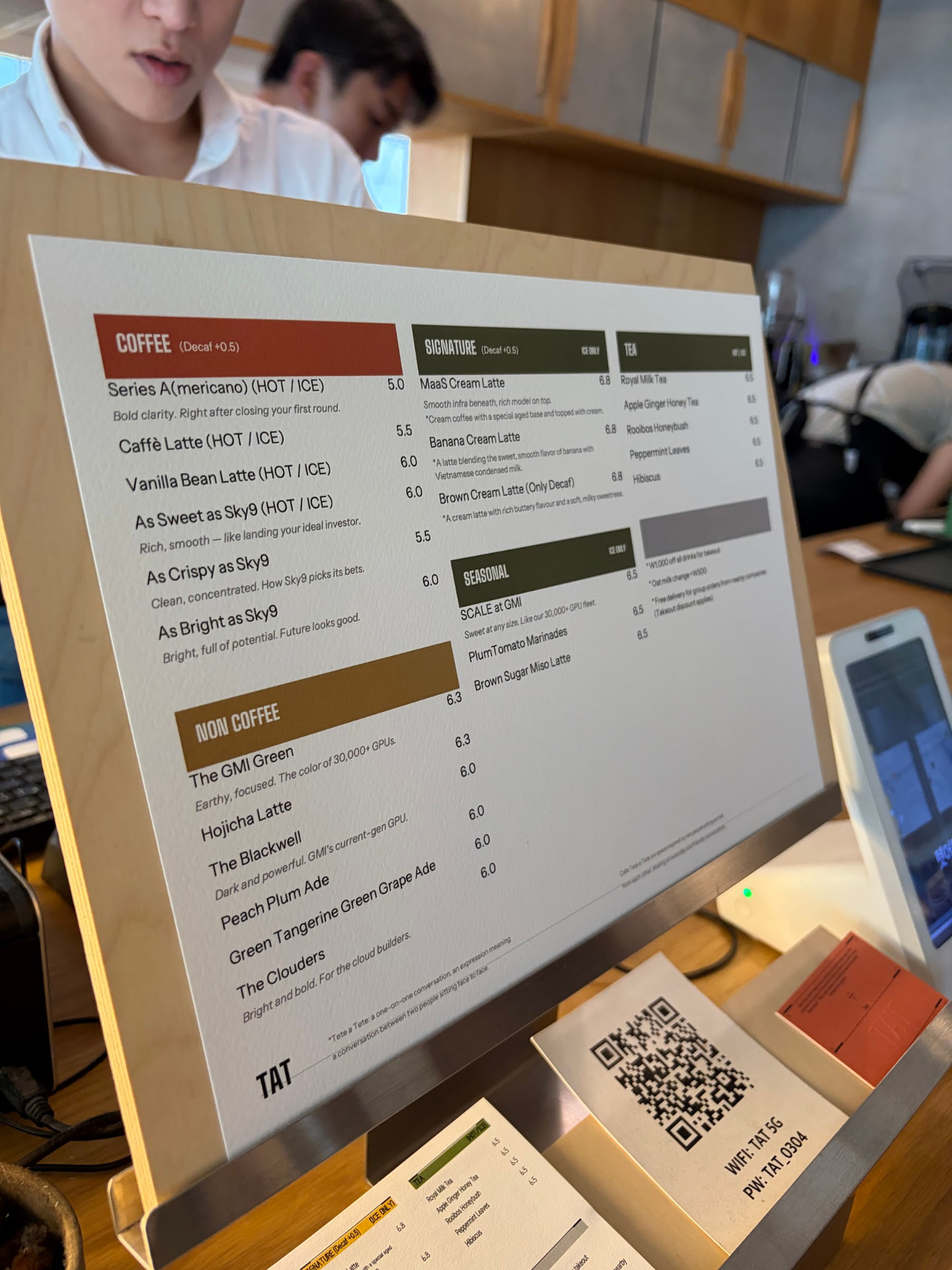 The real printed Cafe GMI menu at the counter